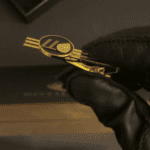 Golden key with black glove
