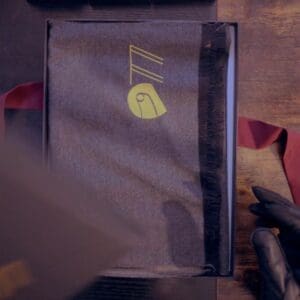 Gloved hand near neatly folded scarf