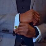 Elegant suit with gold cufflinks close-up
