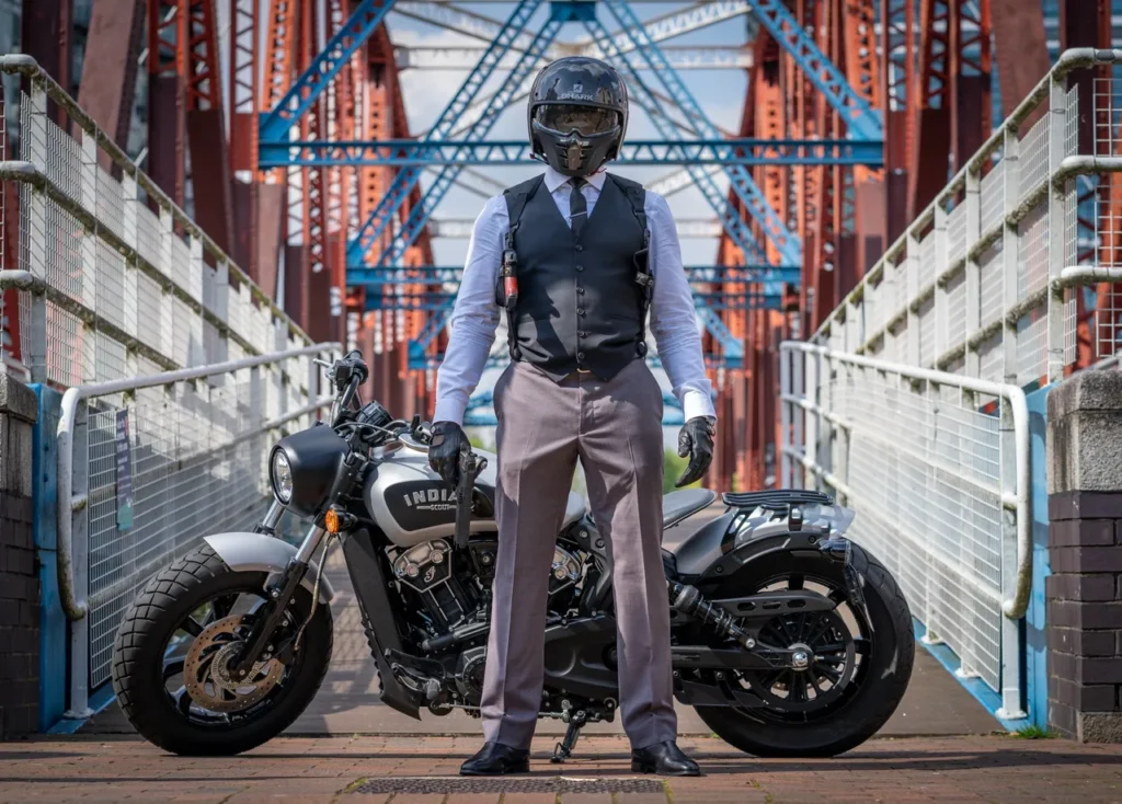 Biker posing on urban bridge