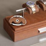 Wristwatches on brown suede display stand