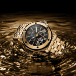 Gold luxury wristwatch on rippled gold surface