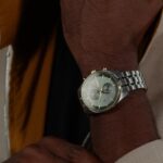 Stainless steel watch with green dial