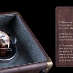 Open leather watch winder with rose-gold watch