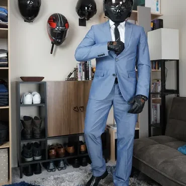 Person in blue suit wearing motorcycle helmet